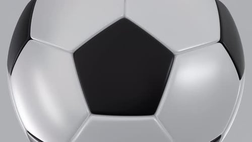 Rotierender weißer und schwarzer Fußballball-Loop-Animationshintergrund in Nahaufnahme