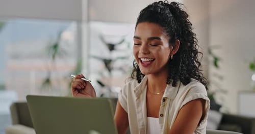 Young Woman Video Calling On Laptop At Home