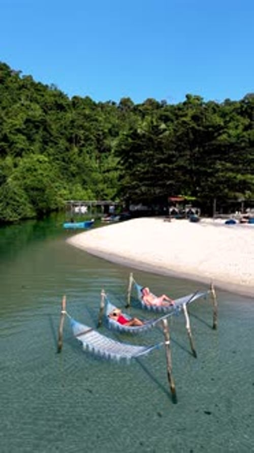 Relaxing on a Hammock in the Crystalclear Waters of Koh Kood Island Thailand