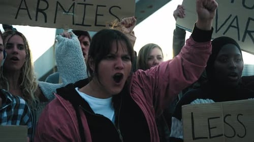 Adults Protesting and Shouting in Urban Area