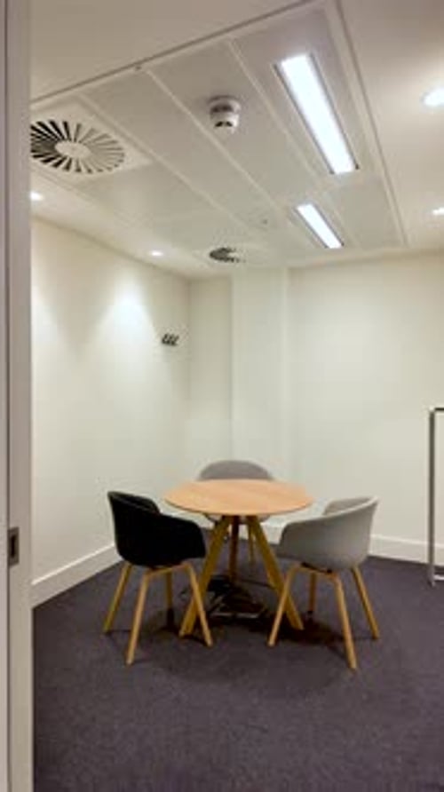 Empty Meeting Room with Table and Chairs