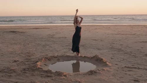 Woman Dancing On The Beach