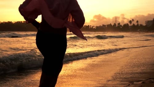 Silhouette of Man Running on Beach Near Sea During Sunset, Super Slow