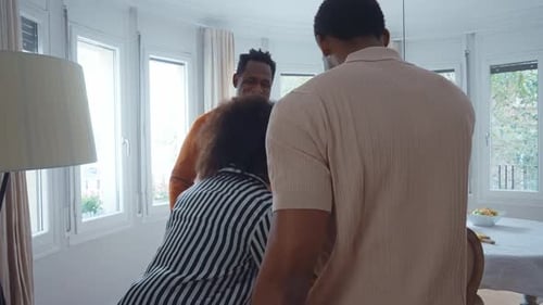 Family Embraces at Home in Natural Light