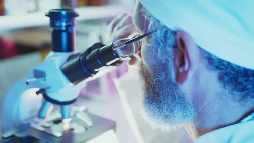 Scientist Using Microscope in a Laboratory