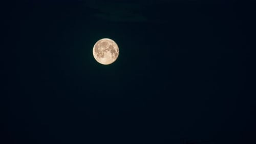 Full Moon Moving Across the Night Sky