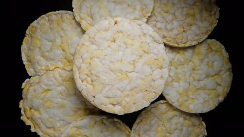Round crispy drykorn tortillas. One rotates above the others.