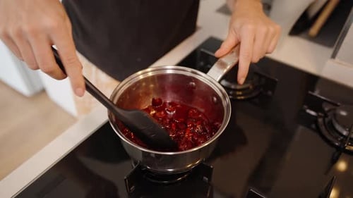 Simmering The Cherries, The Mixture Starts To Thicken Into A Delicious Compote.
