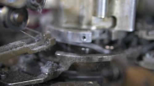 Close-up parts of the with threads, the Production process in a garment factory, automated process,