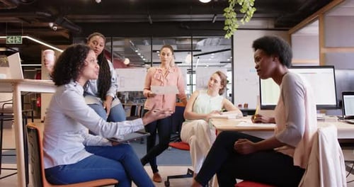 Diverse Group Collaboration in Modern Office Setting