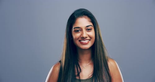 Smiling Woman Makes Heart Shape With Hands