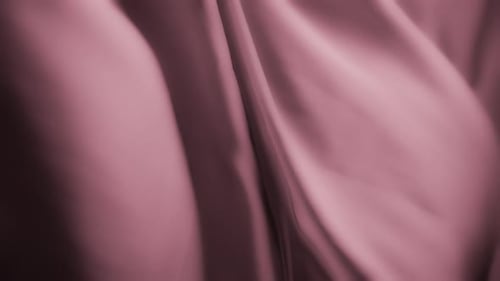 Silky pink fabric waving in the wind. Abstract texture background