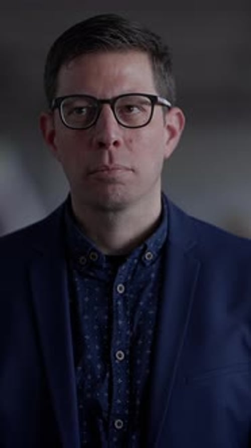 Man in Blue Suit Facing Forward