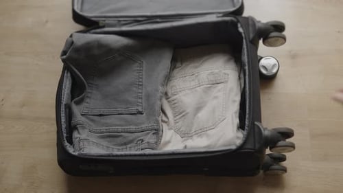 Puts Things in a Suitcase Prepares for a Trip Trip or Business Trip Packs Clothes in a Suitcase with