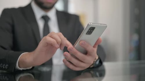 Close up of Businessman Using Smartphone