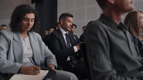 Audience Attends Corporate Presentation at Conference or Seminar
