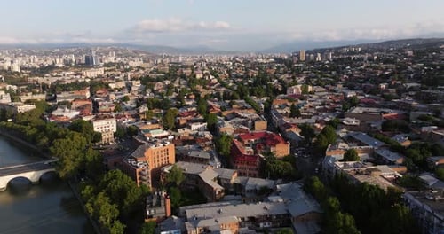 Aerial View Above Tbilisi, Georgia at Sunrise on Typical Summer Day