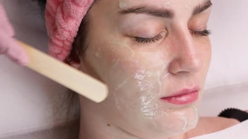 RF Lifting Applying the Gel to the Face of a Young Adult girlFacial Skin Care Facial Rejuvenation
