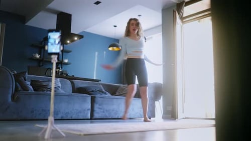 Woman Dances and Records Video in Apartment
