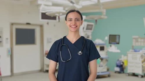 Happy Indian female doctor putting stethoscope on