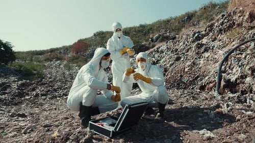 Scientists Examine Pollution at Landfill Dump in Protective Suits