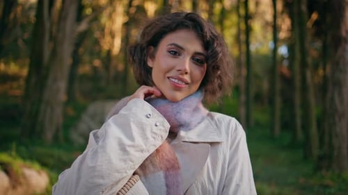 Attractive Woman Wearing Scarf Smiling in Forest