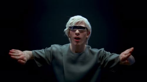 Impressed Guy Playing Augmented Reality in Futuristic Glasses