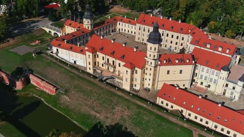 Fly over Nesvizh Palace in Belarus. Drone shot of residential castle. Panoramic view of a castle at