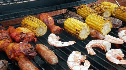Grilled Meats and Vegetables on a Metal Grill