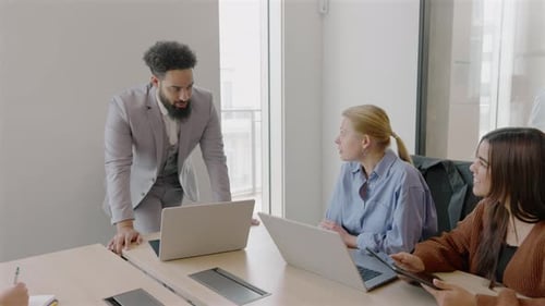 Diverse Professionals Engaging in Collaboration Within a Modern Business Office Space