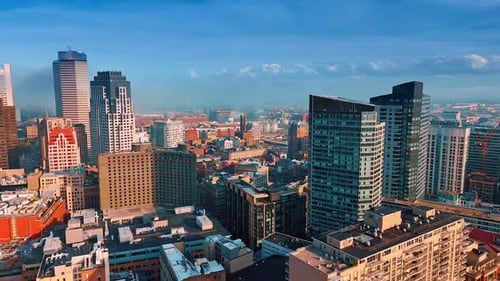 Rise over the dense architecture of Boston, MA, USA on sunny day.