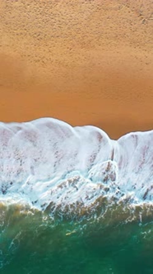 Aerial Drone Shot of Sea Waves on Sandy Coastline at Beach