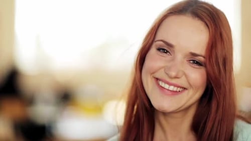 Smiling Woman with Auburn Hair in a Close Up