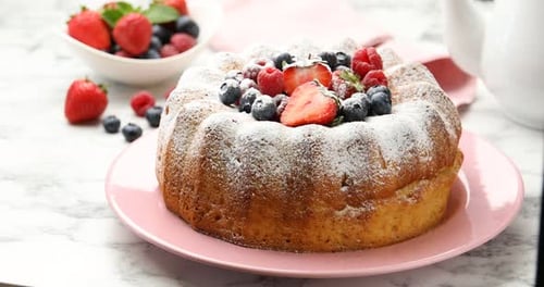 Delicious Cake with Berries and Powdered Sugar