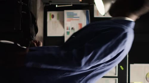 Businessman Working Late at Night in Office