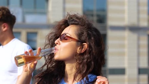 Friends Enjoying Drinks on City Rooftop