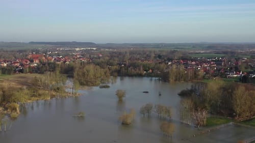 a drone flight over green meadows and fields, which were flooded after heavy rain