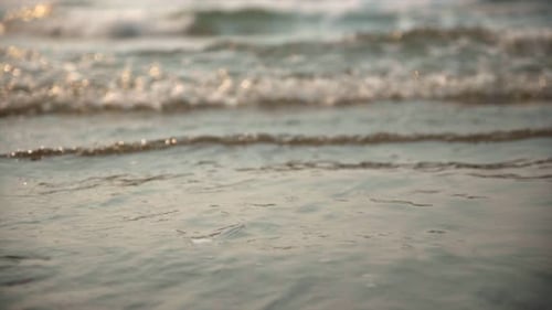 Waves crashing on beach in slow motion. Oregon coast canon beach.