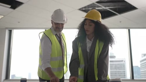 Engineers work in high rise building.