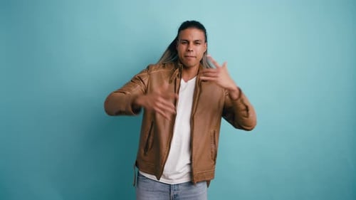 Cool Long Haired Man Dancing and Singing Hip Hop Music in a Studio