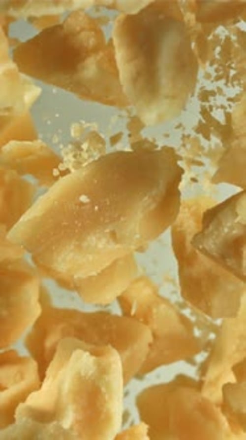 Parmesan Cheese Flies Up and Falls Down Filmed on a Highspeed Camera at 1000 Fps