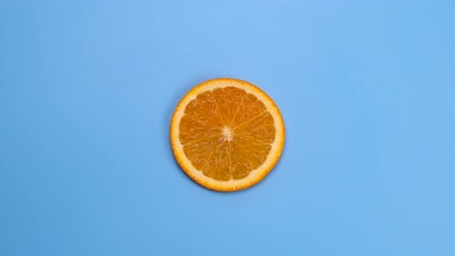 Rotate Half Orange Isolated on Blue Background