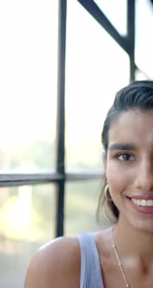 Half Face Close Up of Smiling Woman Indoors