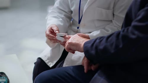 Specialist Using Pulse Oximeter