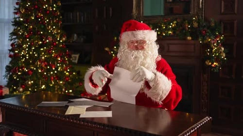 Santa Claus Reading Letters at Christmas