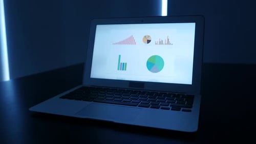 Laptop Displays Financial Data and Chart Animations
