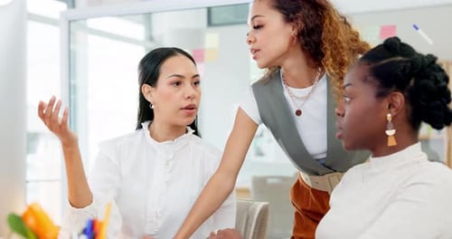 Women Collaborating on a Computer in Modern Office