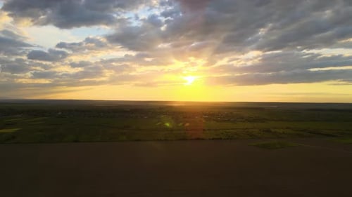 Aerial Landscape View of Cultivated Agricultural Fields on Vibrant Summer Evening