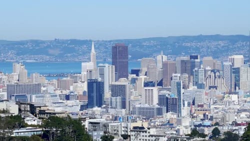 San Francisco downtown skyline and the Bay Bridge with Ocean and mountains in background