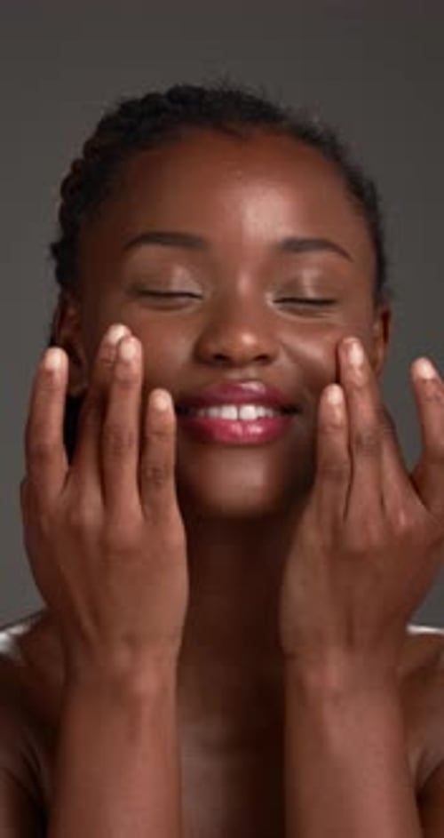 Cream, skincare and black woman with beauty, glow and dermatology on gray studio background